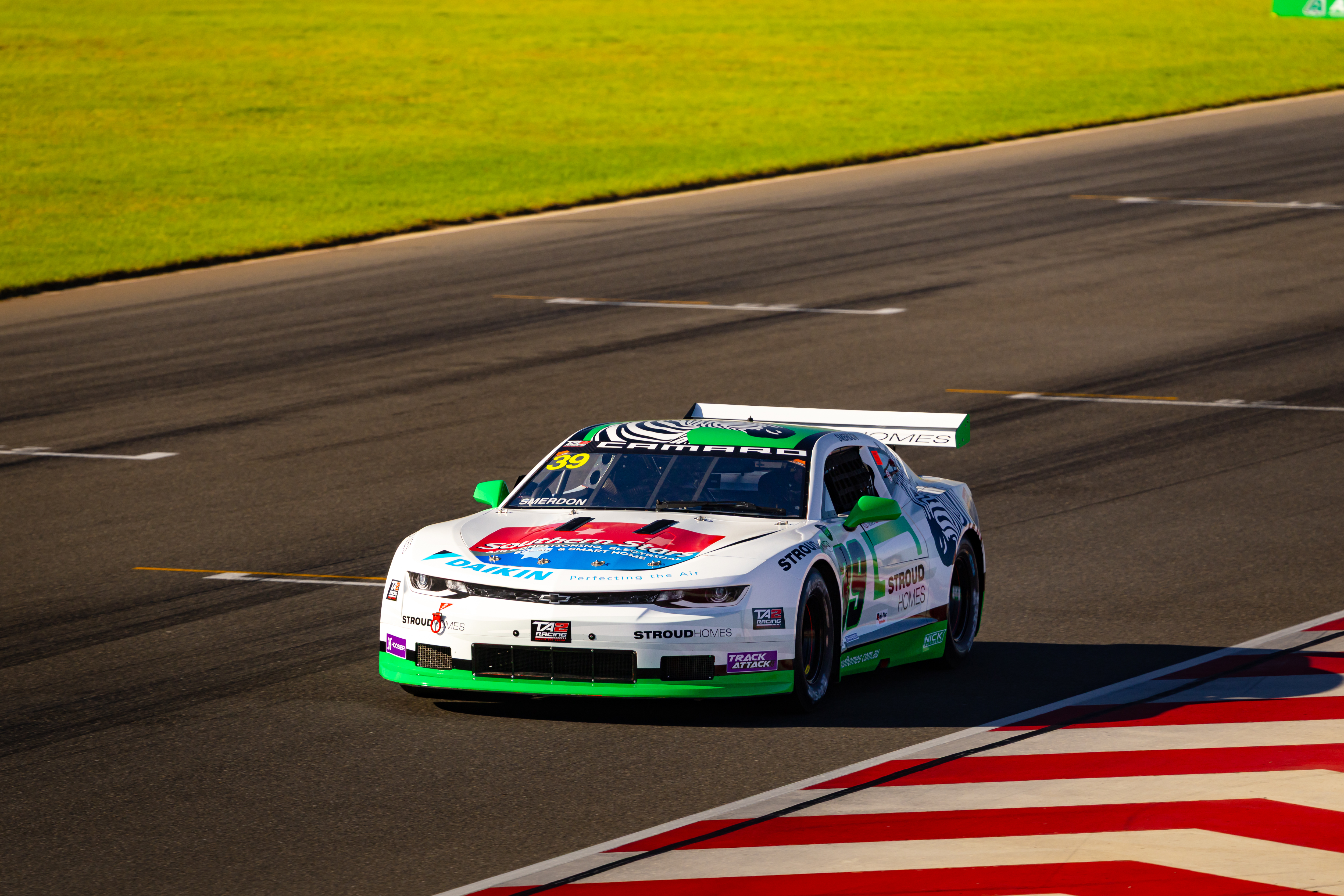 Race car with high-impact motorsport livery and sponsor branding